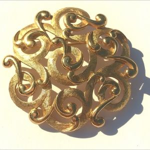 Vintage gold tone swirl brooch